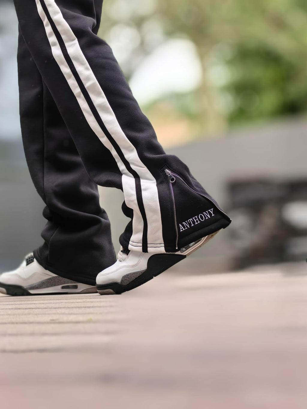 Anthony leaps track pants