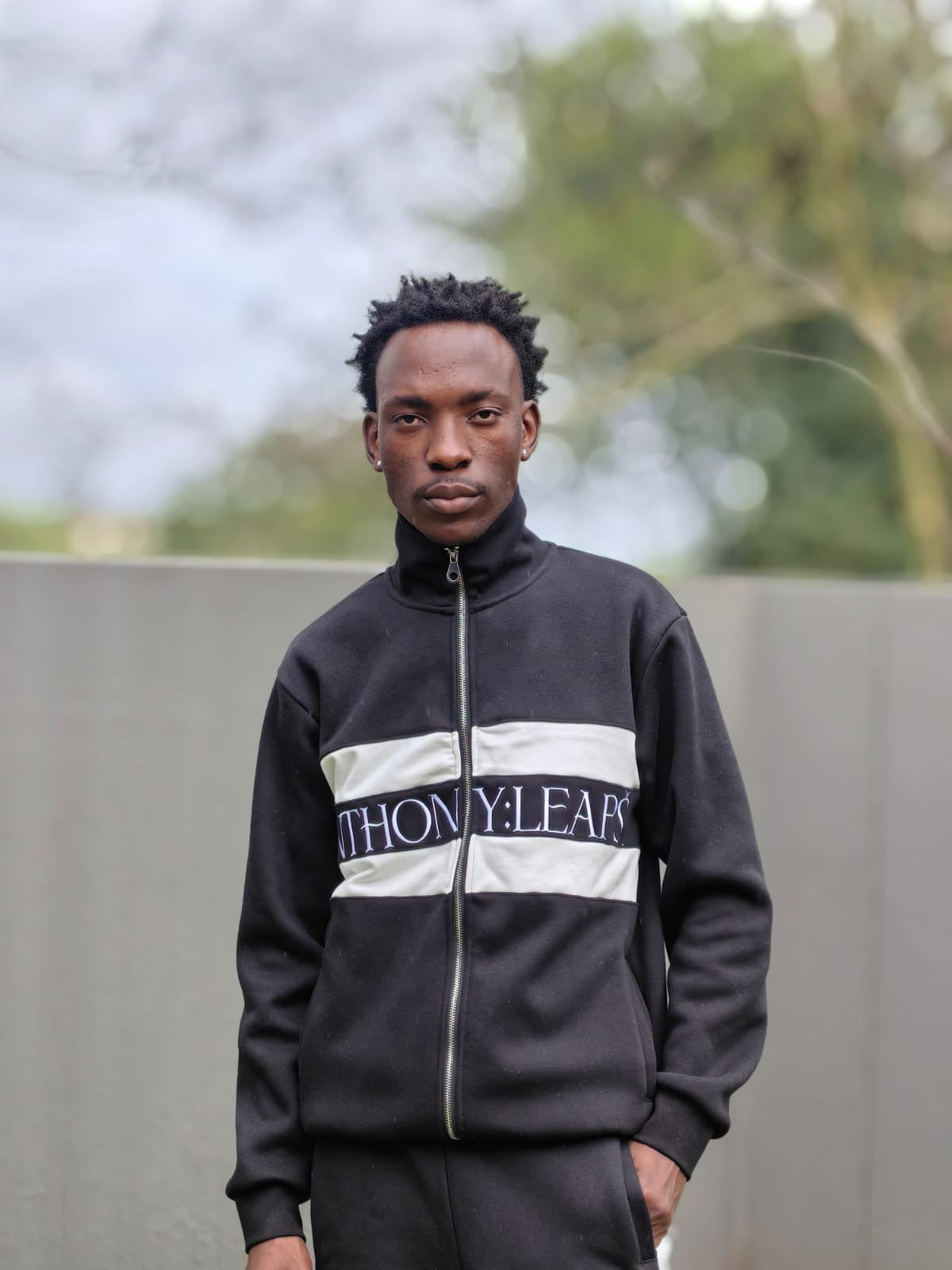 Anthony leaps track top cross branded